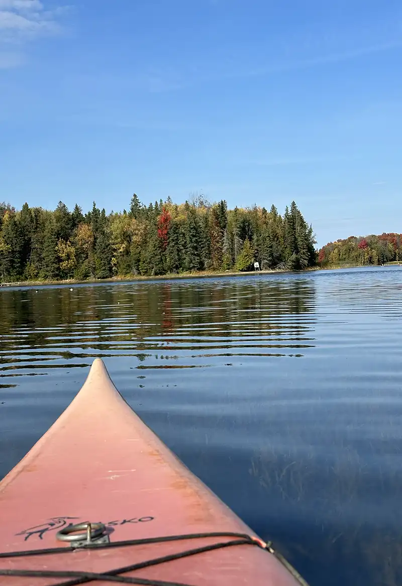 kayaking on island lake with cooking on camping stove